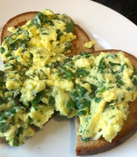 Scrambled egg and spinach on toasted dutch rye bread