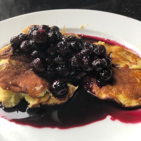 Banana pancakes with warmed blueberries